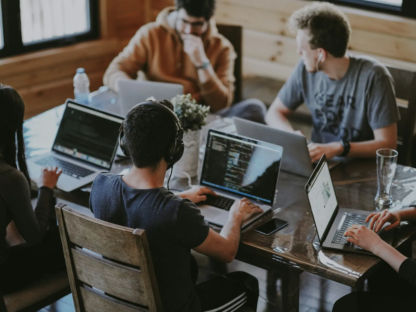 Professional team collaborating around a conference table on a security plan